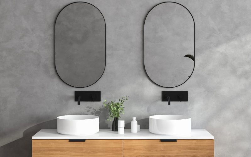 Two round wall-mounted bathroom mirrors