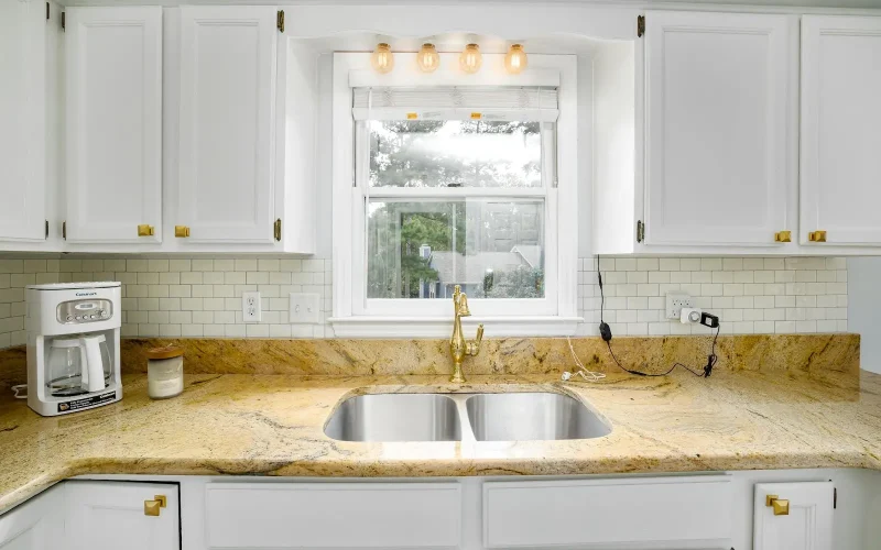 A beautiful kitchen sink on a white kitchen